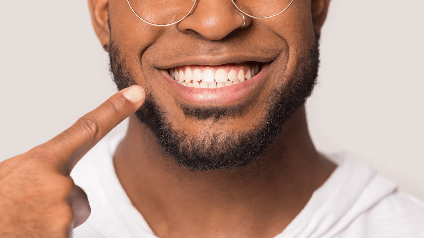 man in glasses pointing to tet
